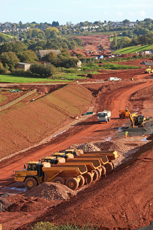 dump trucks on a road construction site